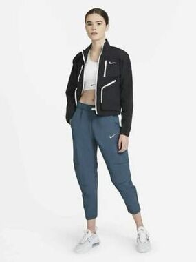 Nike Women's Sportswear Tech Pack Woven Pants in Blue.